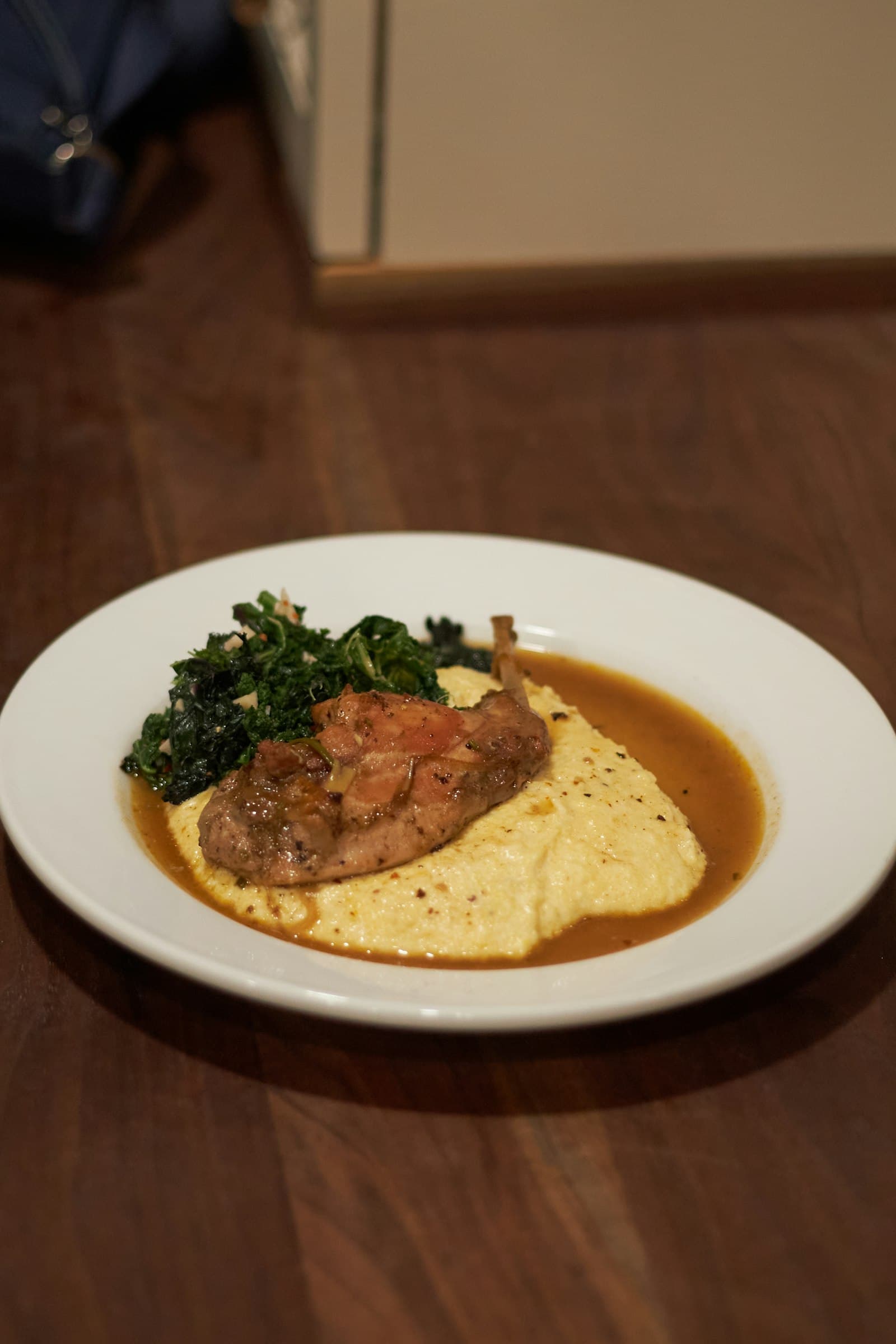 Rabbit plated with greens and a light sauce